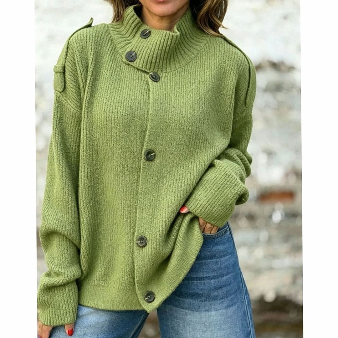 Cárdigan de mujer en punto canalé grueso y suave, diseño oversize con cuello alto, perfecto para combinar.