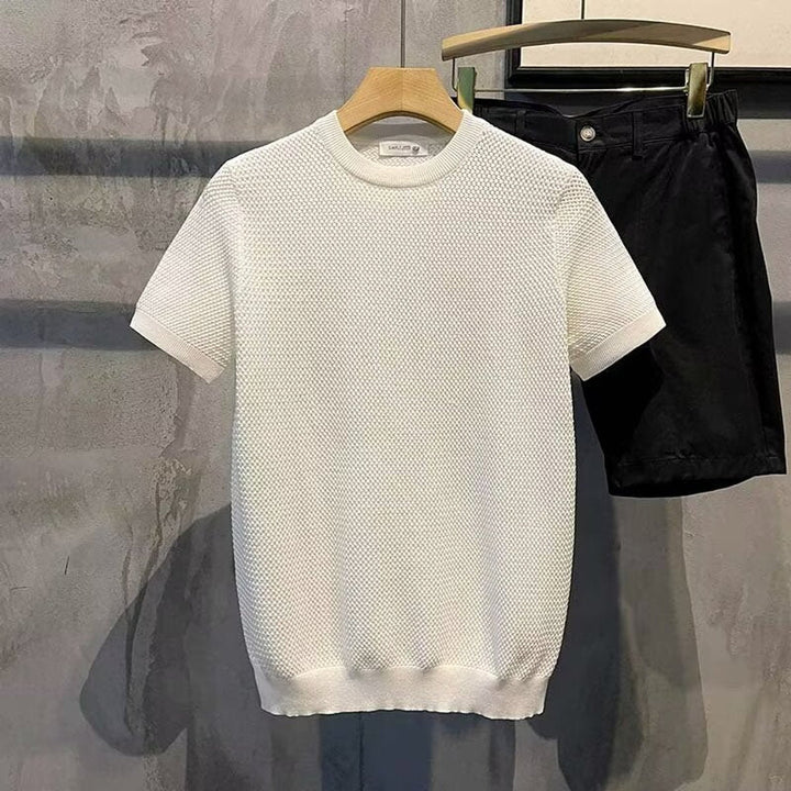 Camisa de algodón con punto texturizado en crema para hombre. Corte relajado, cuello redondo, máxima comodidad.