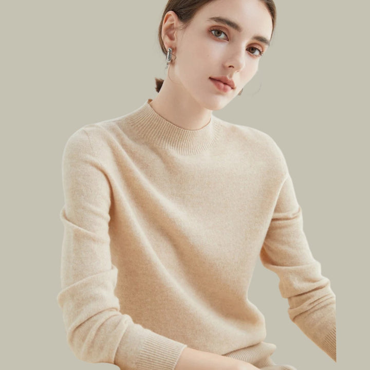 Jersey de punto fino, cuello alto de lana merina, femenino y sofisticado.