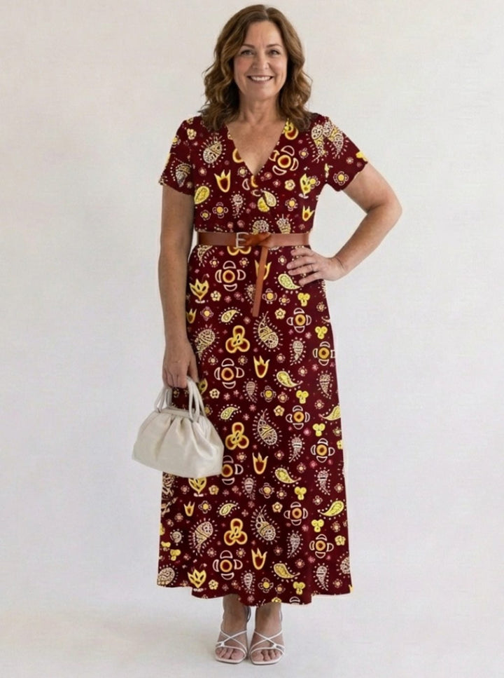 Vestido floral midi rojo con escote V y manga corta, una prenda clave para el armario de mujer.