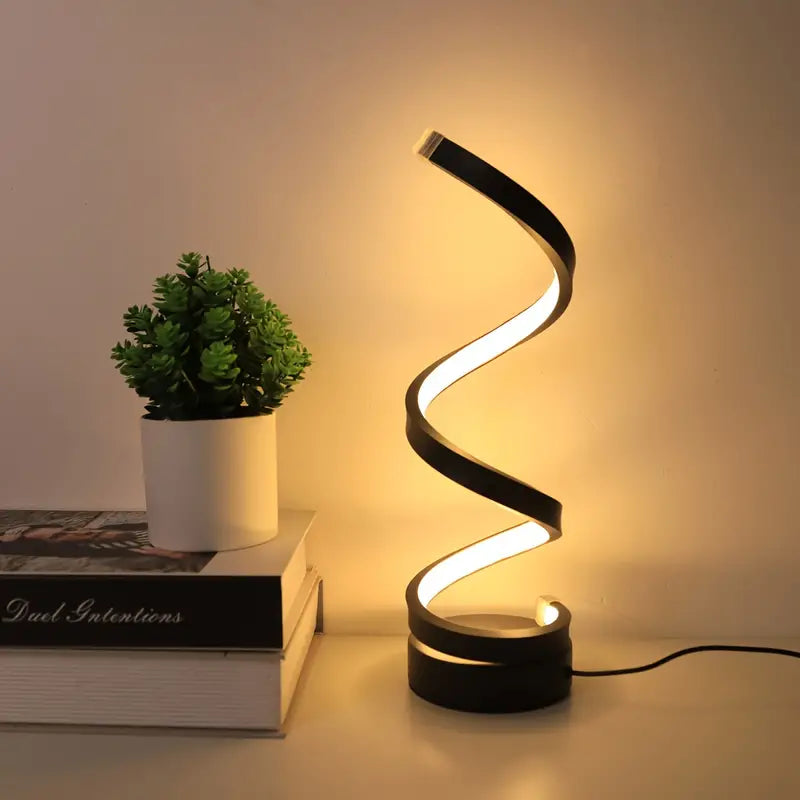 Lámpara de mesa LED espiral moderna con iluminación regulable. Ideal para oficina y hogar.