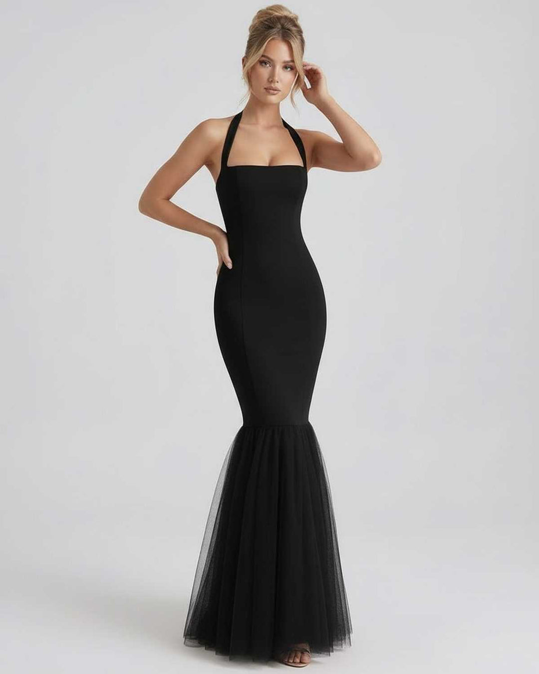 Vestido maxi negro de mujer, con cuello halter y espalda abierta, ideal para noche y eventos glamurosos.