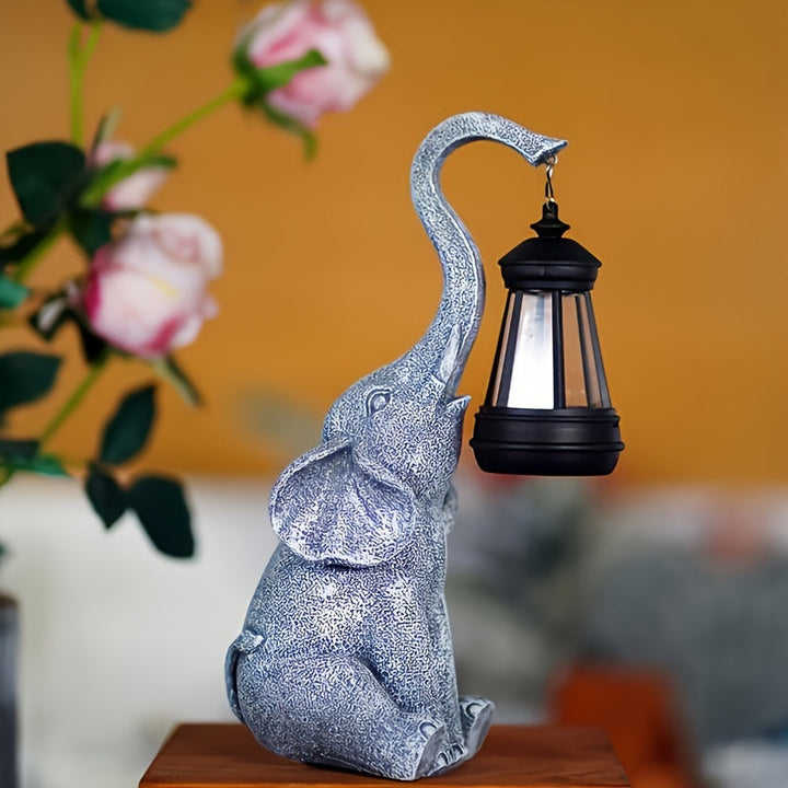 Elefante de resina con luz solar para jardín. Iluminación exterior ambiental con energía limpia.