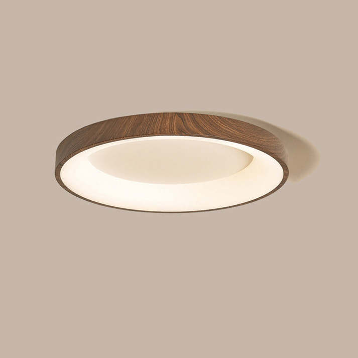 Plafón circular de madera nogal con iluminación LED integrada. Diseño elegante para un hogar con luz moderna.