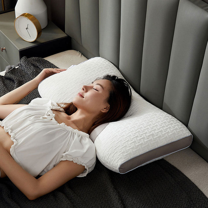 Almohada de soporte ergonómica para cuello y hombros, optimizada para dormir de espalda y de lado, mejora el descanso.