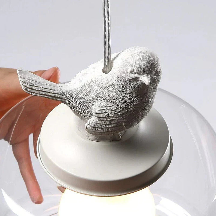 Lámpara colgante con figura de pájaro. Cilindro de vidrio, diseño moderno. Perfecto para hogar.