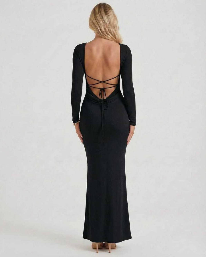 Vestido de noche maxi negro con espalda descubierta, ideal para galas y fiestas elegantes.