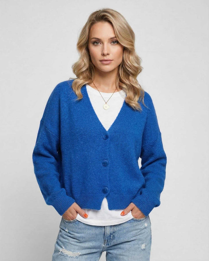 Cárdigan azul vibrante para mujer, tejido suave. Estilo casual moderno, ideal para otoño y primavera.