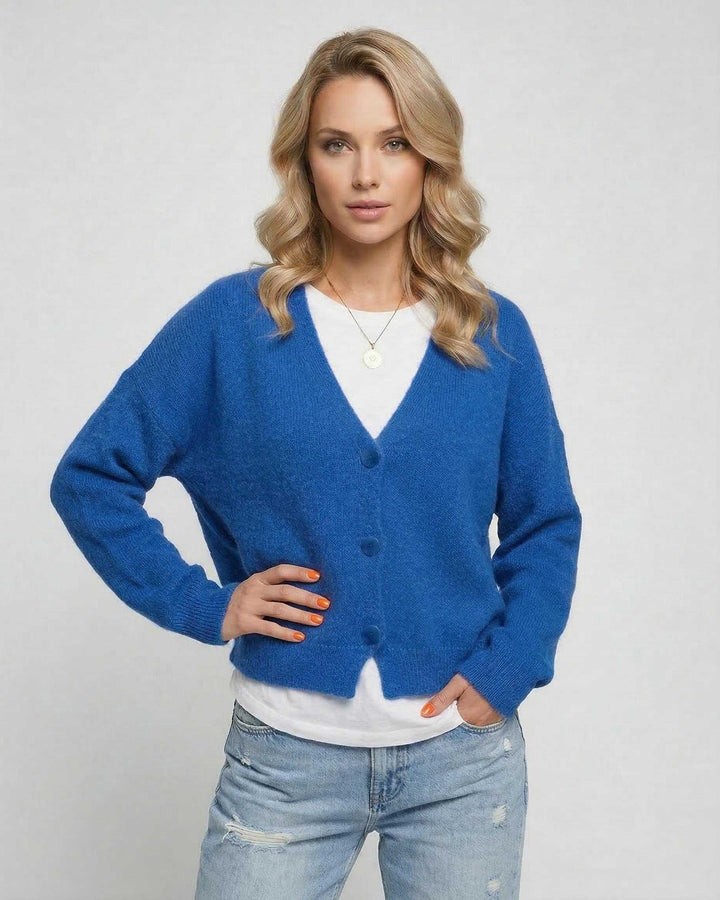 Cárdigan azul vibrante de manga larga para mujer, estilo moderno y casual. Ideal para otoño.