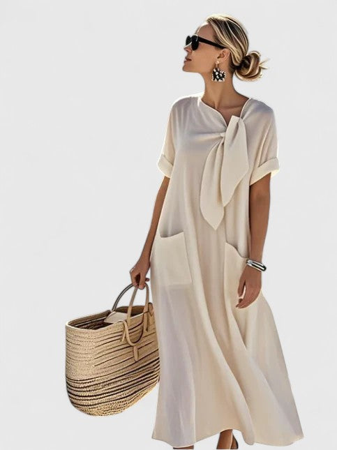 Vestido largo fluido para mujer, cómodo y versátil. Lazo decorativo que añade estilo femenino.