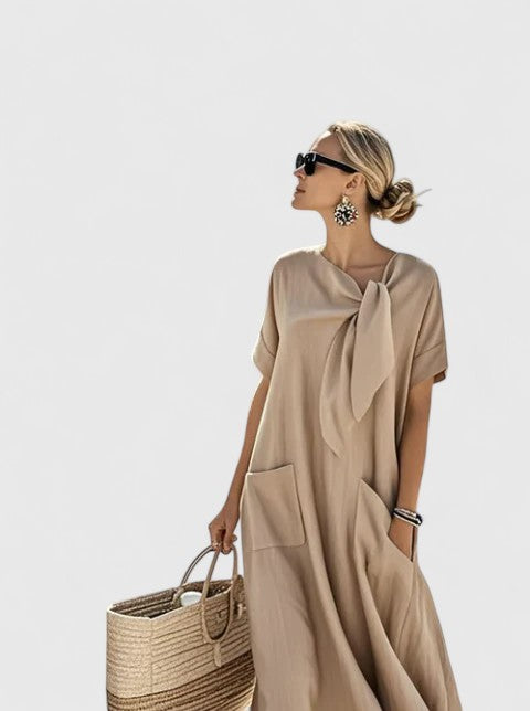 Vestido maxi fluido de mujer, diseño elegante con lazo ajustable. Perfecto para un look casual o formal.