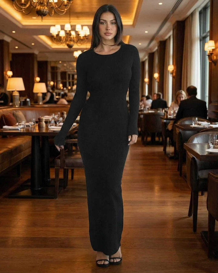 Vestido maxi negro, manga larga, espalda abierta. Prenda elegante y estilizada para mujeres.