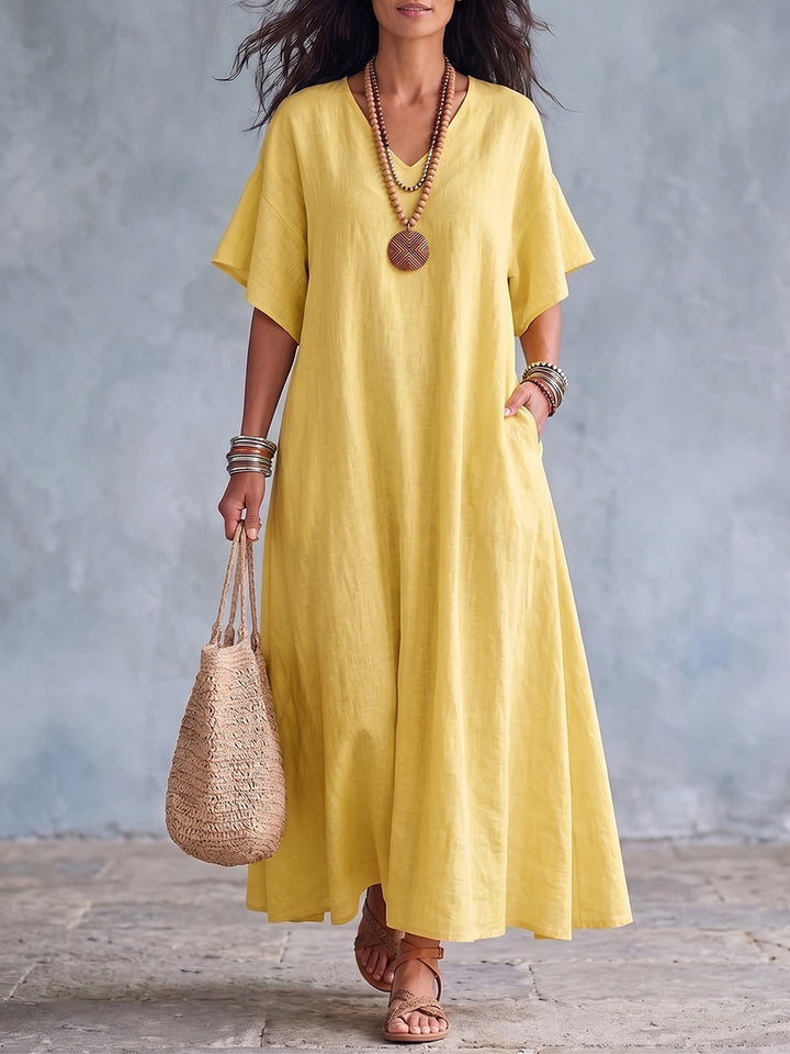 Elegante vestido largo de mujer de algodón lino, cuello V, ideal para un verano fresco y con estilo.