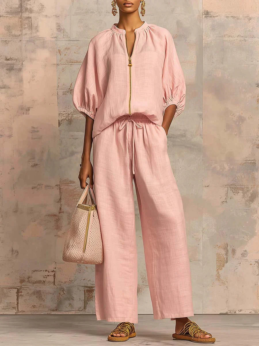 Mujer luciendo conjunto de verano de dos piezas: camisa relajada y pantalón ancho elegante.