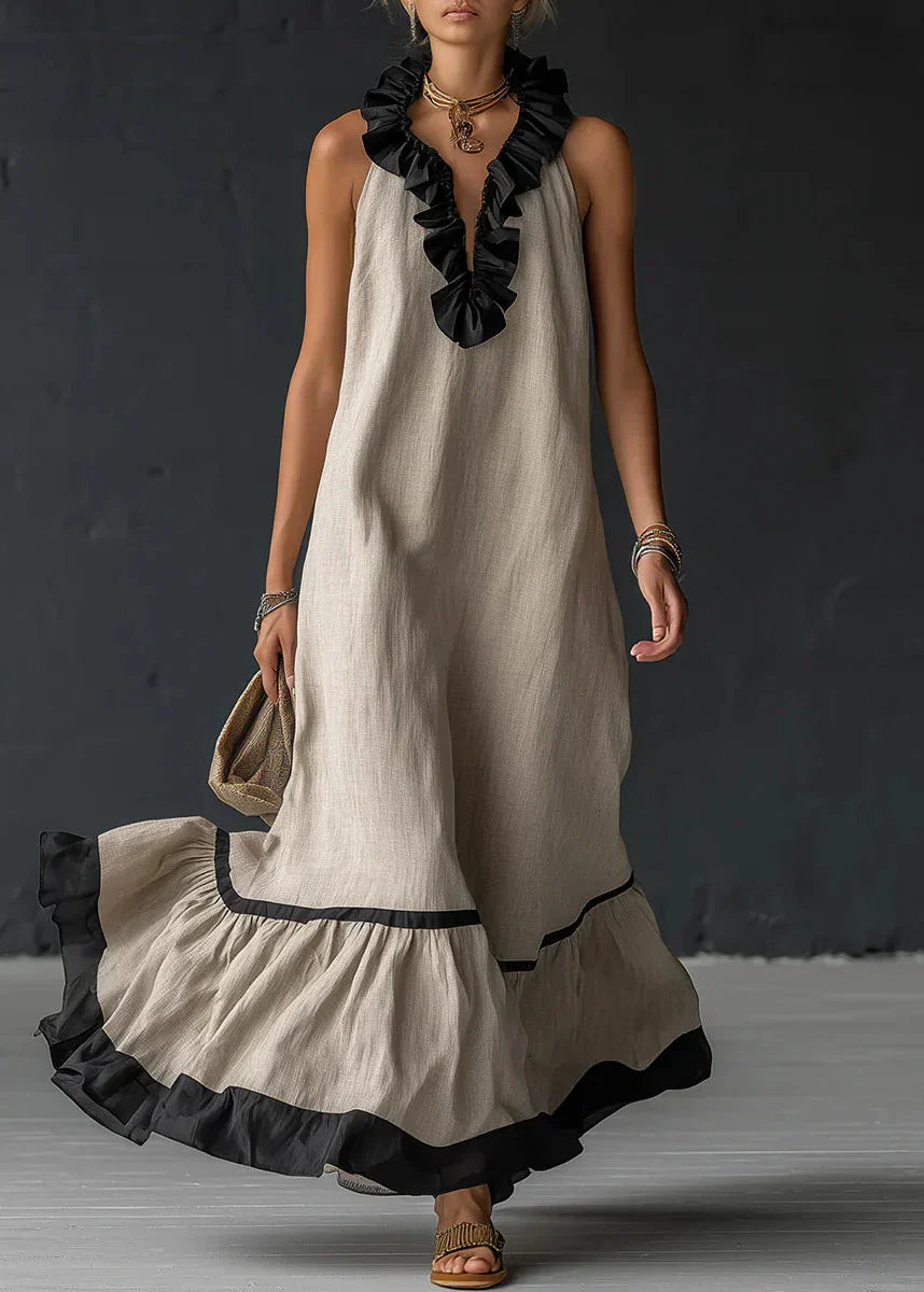 Vestido largo de mujer, cuello halter y volantes. Moda de verano en algodón lino, ropa elegante casual.