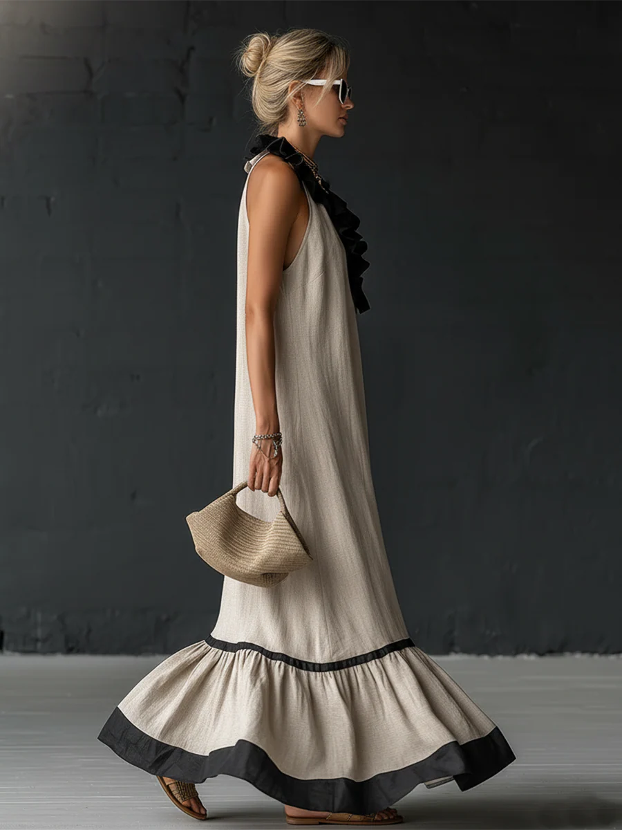 Textura de tejido lino-algodón en vestido maxi boho bicolor, ideal para un look veraniego fresco y casual.