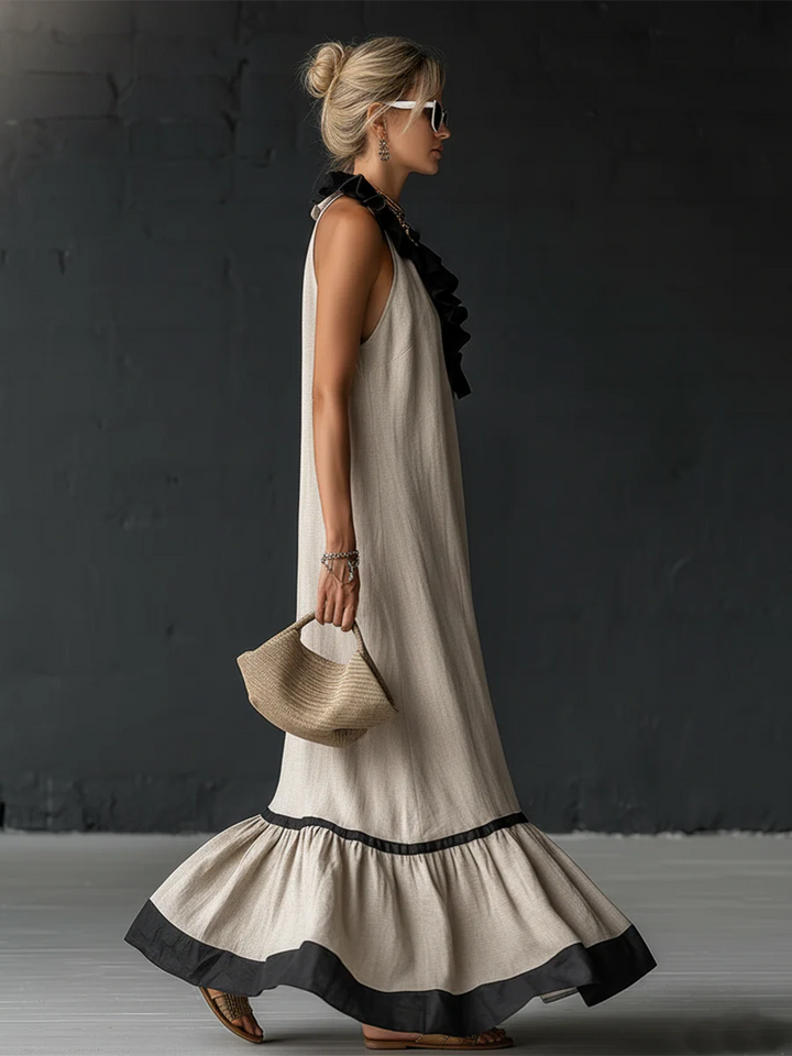 Textura de tejido lino-algodón en vestido maxi boho bicolor, ideal para un look veraniego fresco y casual.