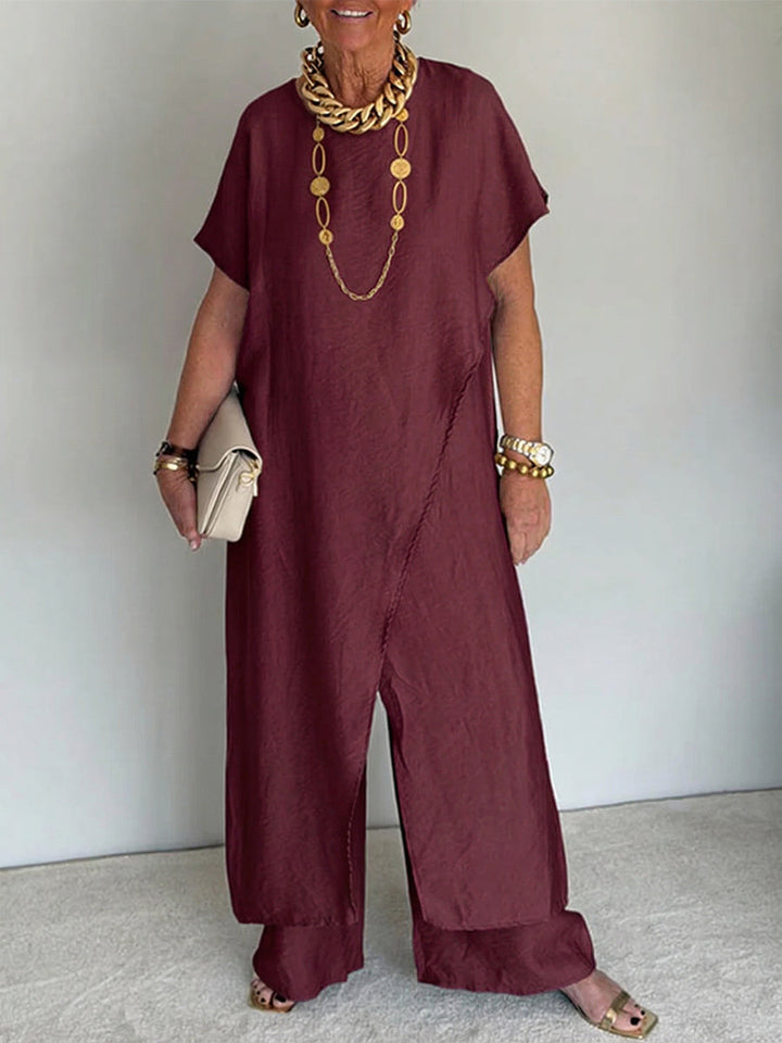 Mujer luciendo conjunto de lino asimétrico, túnica elegante y pantalón ancho, ideal para comodidad y estilo.