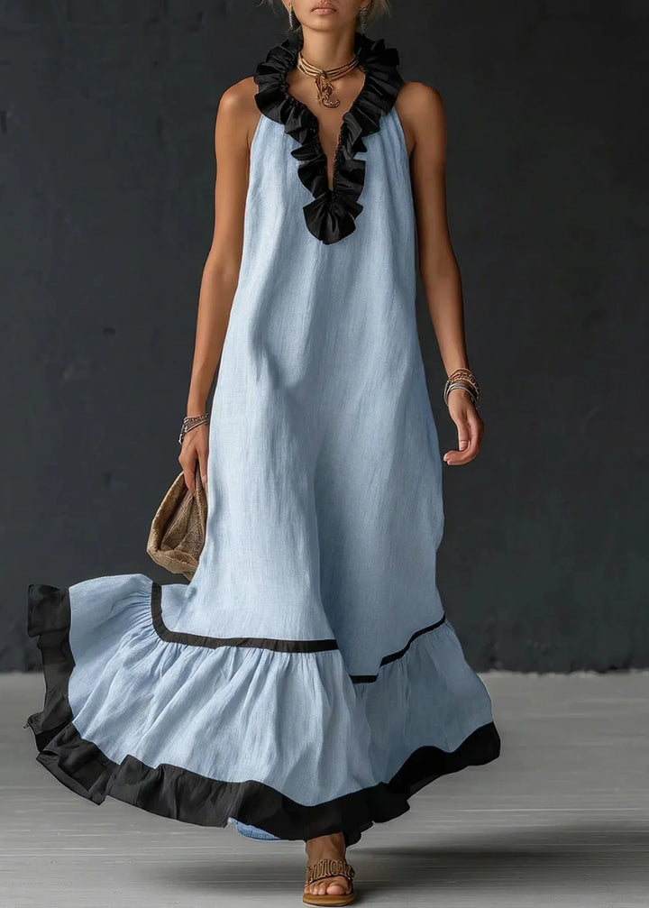 Vestido de mujer largo de algodón lino, cuello halter y volantes. Fresco y elegante para el verano.