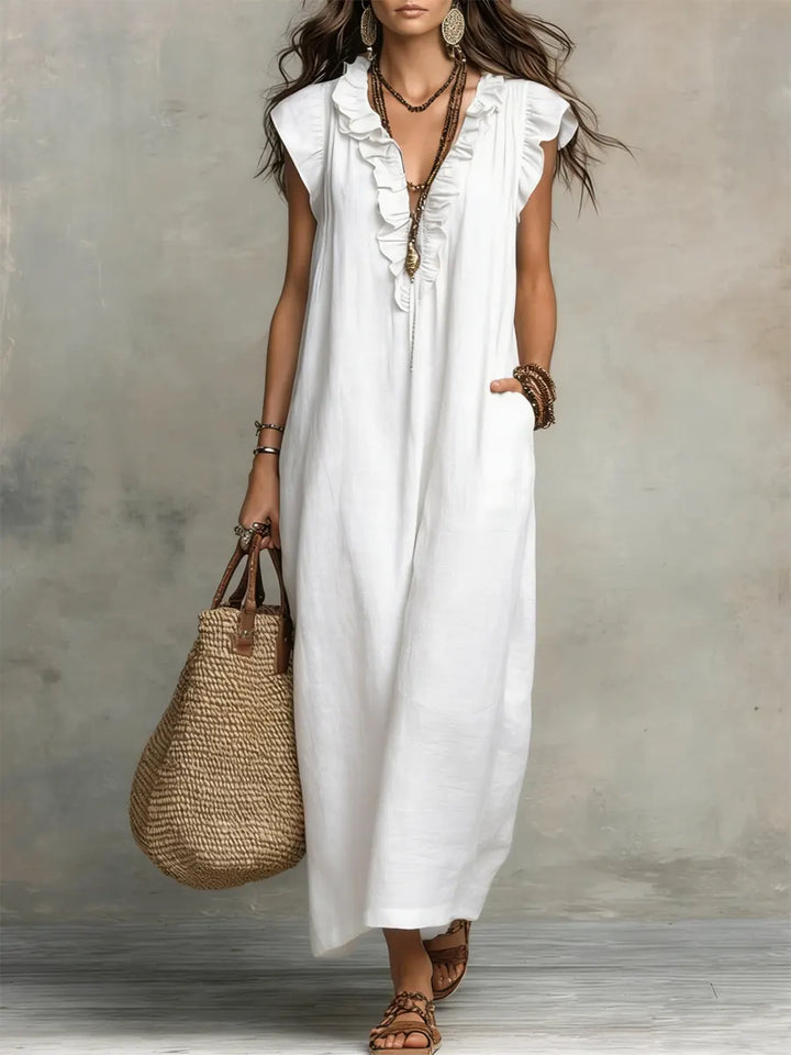 Vestido largo bohemio con detalles de volantes. Estilo fluido, fresco y cómodo para mujer, ideal para el verano.