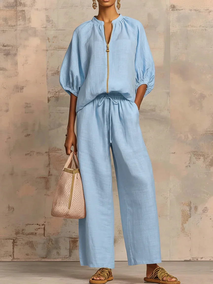Detalle de conjunto de mujer: camisa relajada y pantalón ancho fluido. Moda cómoda y elegante.