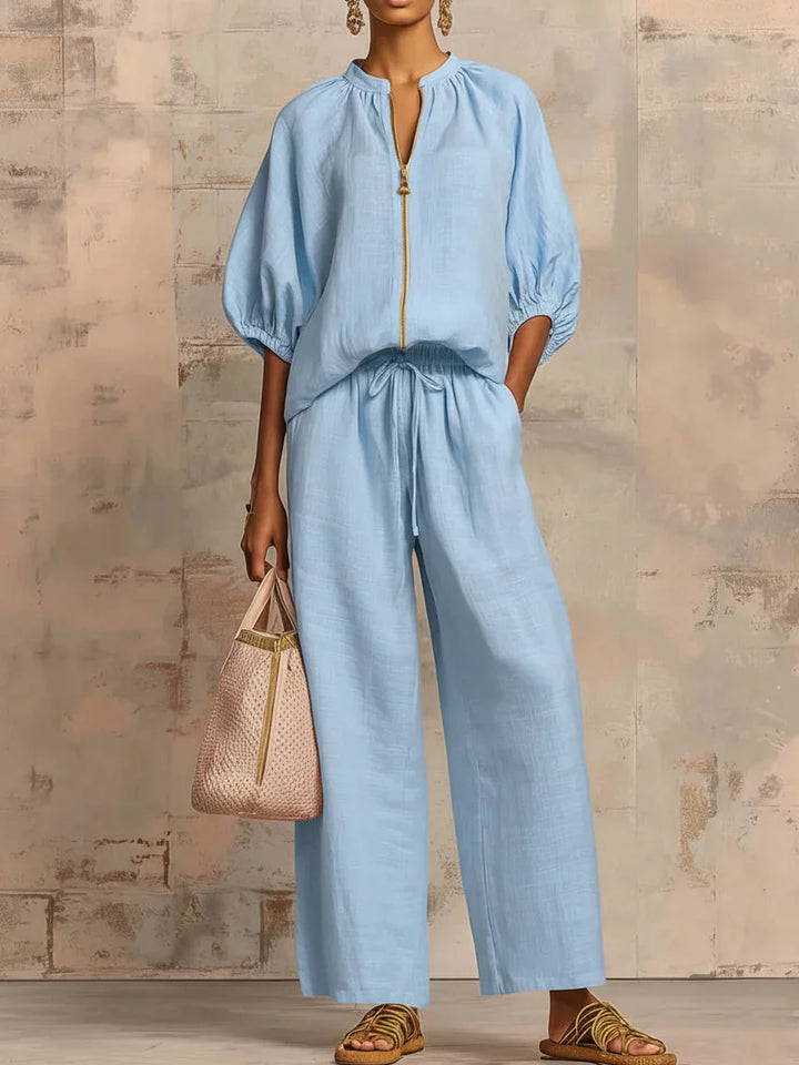 Detalle de conjunto de mujer: camisa relajada y pantalón ancho fluido. Moda cómoda y elegante.
