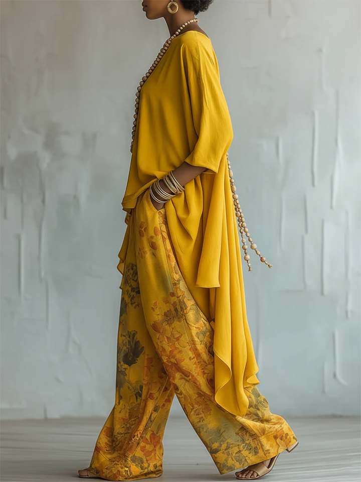 Conjunto de mujer fluido y bohemio: blusa asimétrica y pantalón estampado floral, cómodo para ropa de verano.