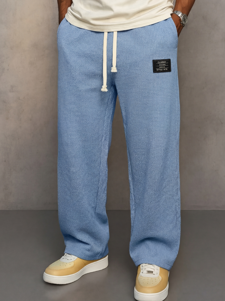 Pantalón ancho casual unisex con cintura ajustable, ideal para comodidad y estilo de verano.
