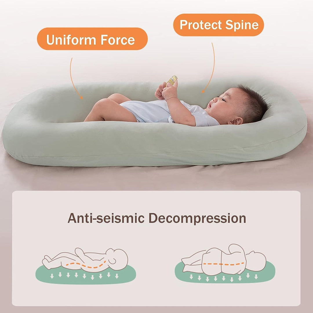 Nido bebé de algodón con bordes protectores, para un descanso seguro y confortable.