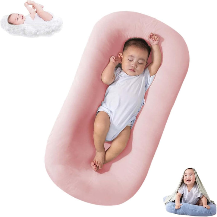 Bebé durmiendo plácidamente en cojín nido de algodón suave. Confort seguro para recién nacidos.