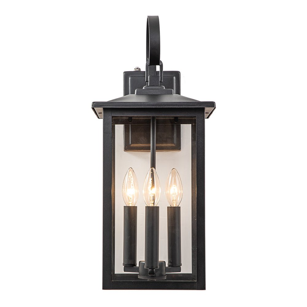 Iluminación exterior negra con vidrio claro, estilo moderno industrial. Perfecta para tu jardín o balcón.