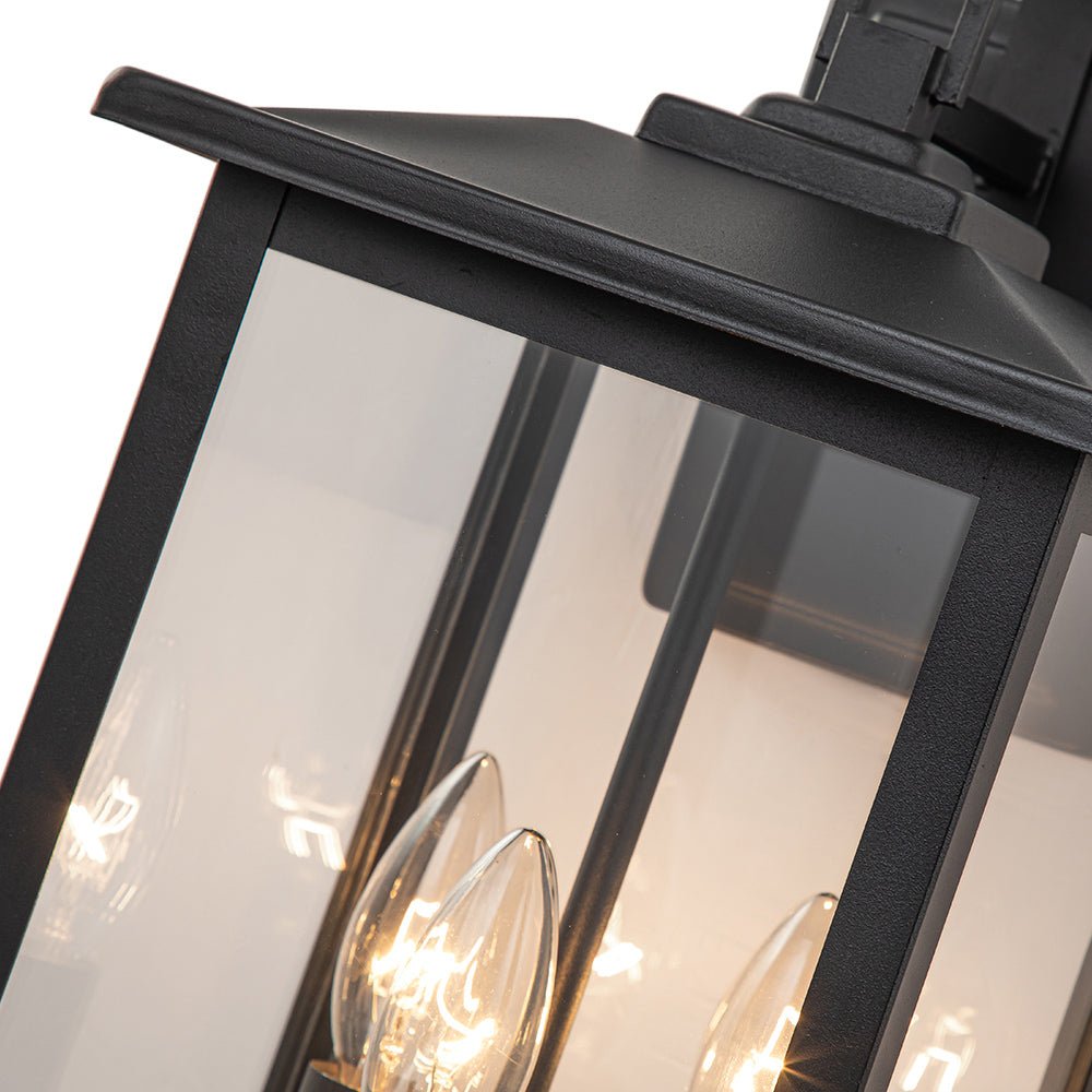 Iluminación de pared exterior moderna IP23. Diseño industrial negro con 3 focos de vidrio claro para jardín.