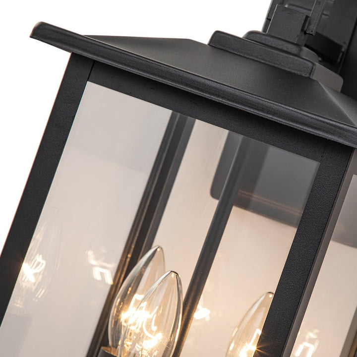 Iluminación de pared exterior moderna IP23. Diseño industrial negro con 3 focos de vidrio claro para jardín.