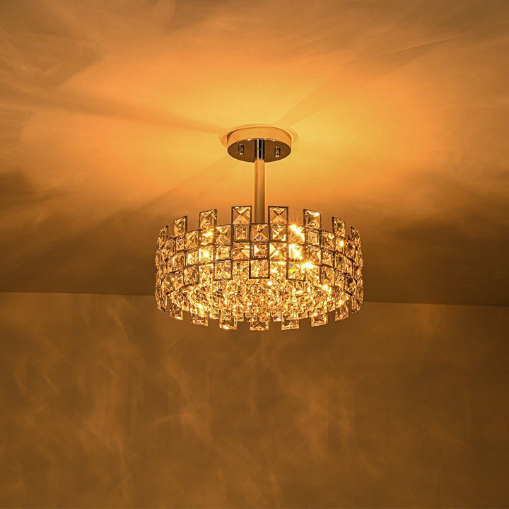 Lámpara de techo de 4 luces de cristal estilo glam. Detalles cromados o dorados. Ideal para decoración interior.