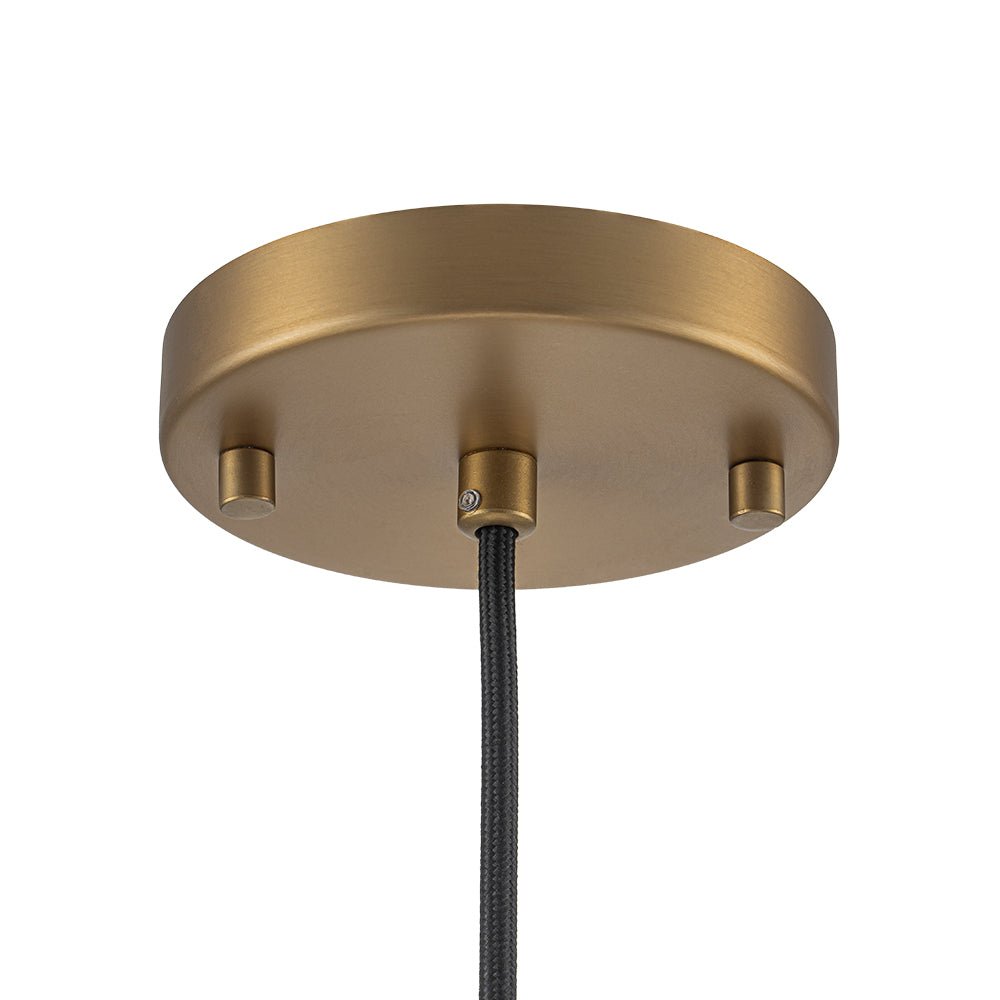 Lámpara colgante globo de vidrio semilla y latón, iluminación elegante para mesa comedor.