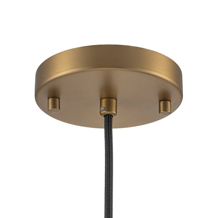 Lámpara colgante globo de vidrio semilla y latón, iluminación elegante para mesa comedor.