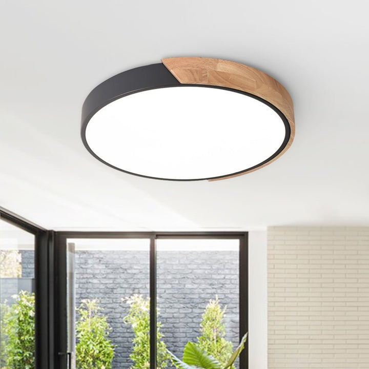 Iluminación LED de techo redonda regulable con acento de madera, perfecta para la decoración del hogar.