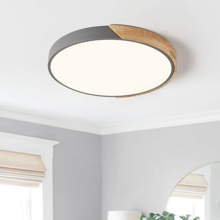 Montura de techo LED regulable con diseño redondo y detalles de madera, iluminación moderna para el hogar.