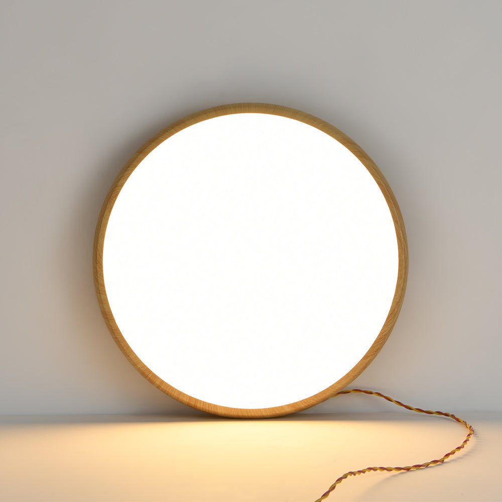 Plafón LED redondo minimalista de techo, con elegante textura de madera para iluminación.