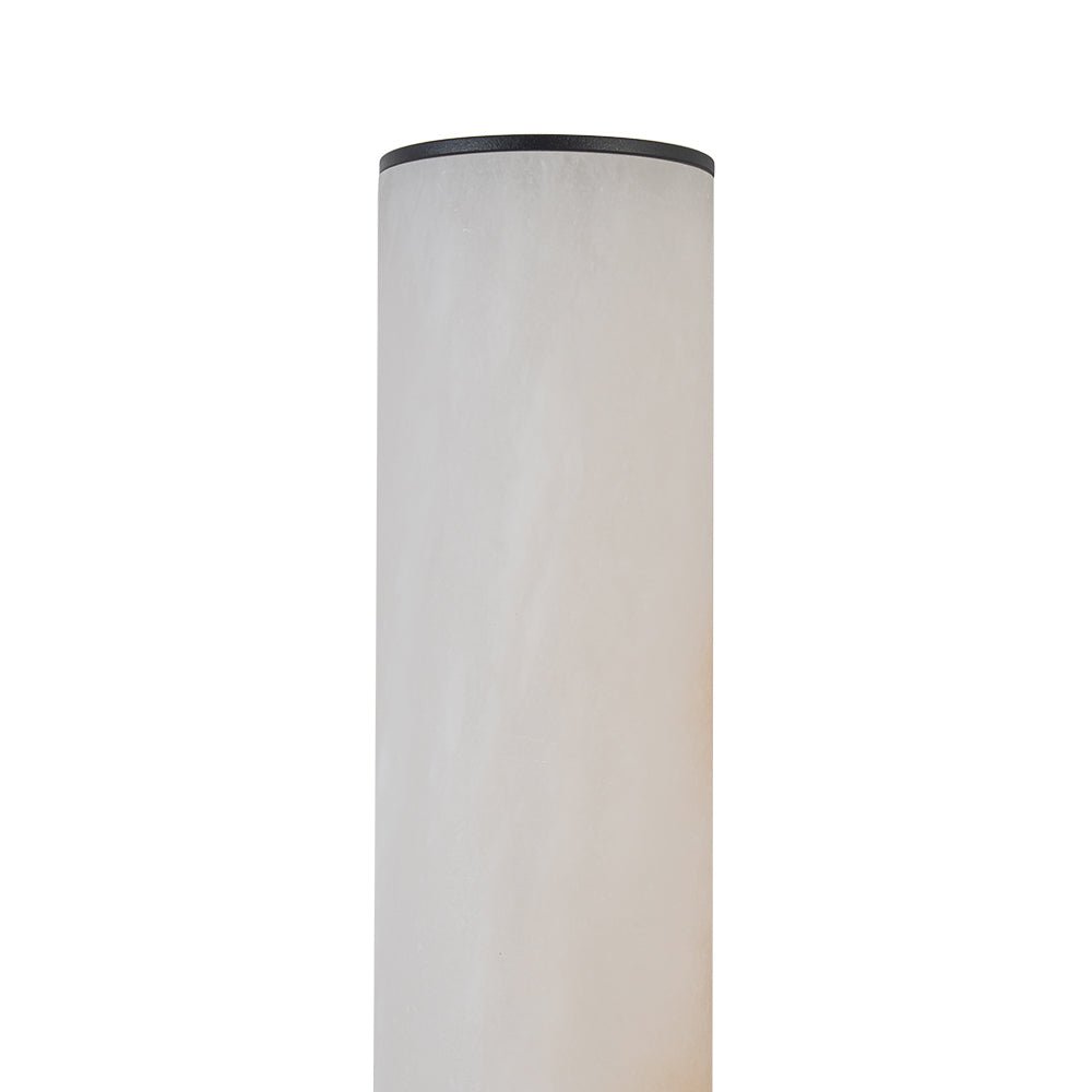 Iluminación LED moderna de pared con aplique de mármol negro y diseño cilíndrico.