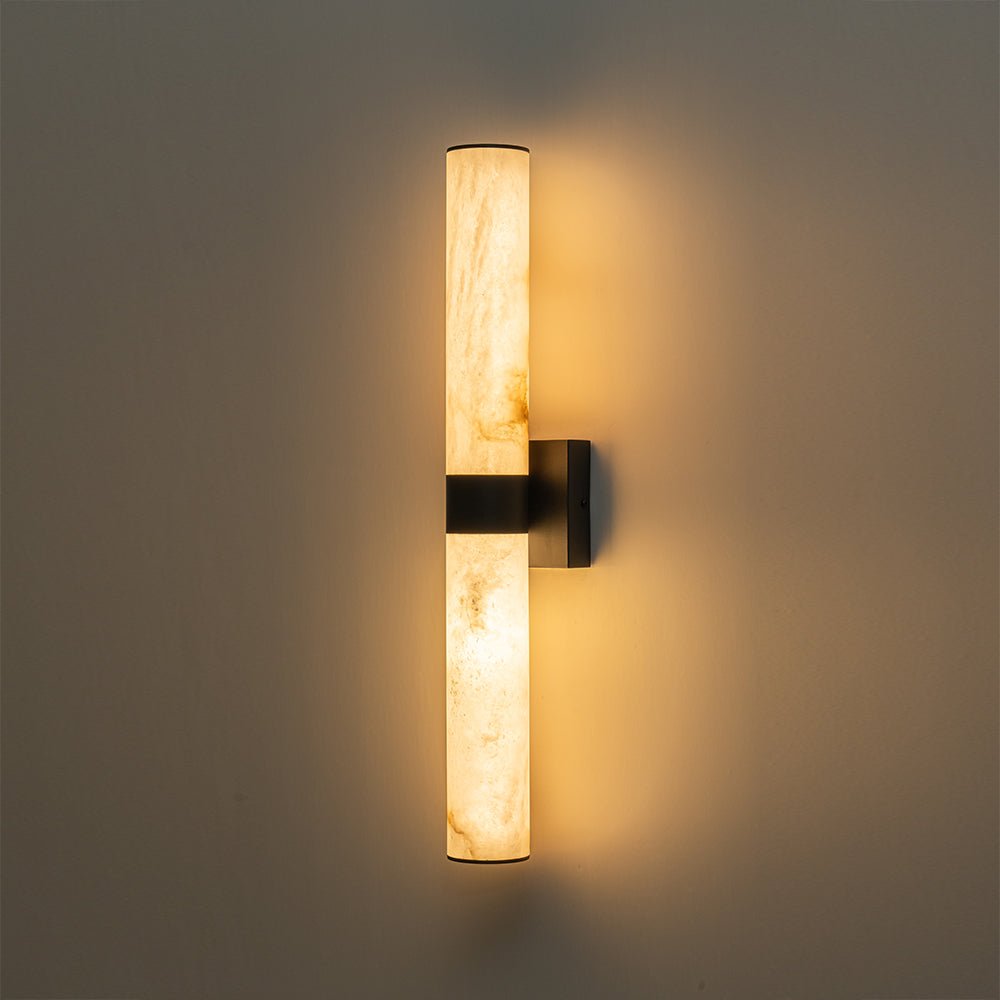 Aplique de pared LED de mármol negro, diseño cilíndrico moderno para interior.