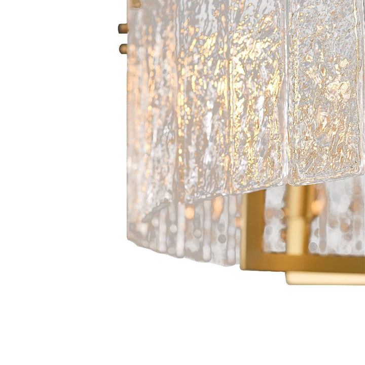 Candelabro de 6 luces, diseño de tambor moderno con vidrio ondulado, versátil para sala o comedor.