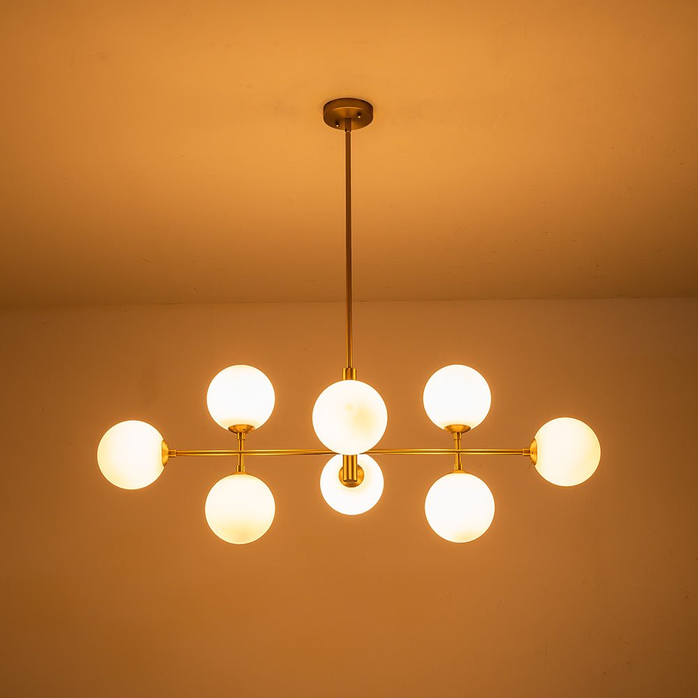Candelabro moderno lineal de 8 luces con vidrio opal para cocina. Ideal como iluminación sobre isla.
