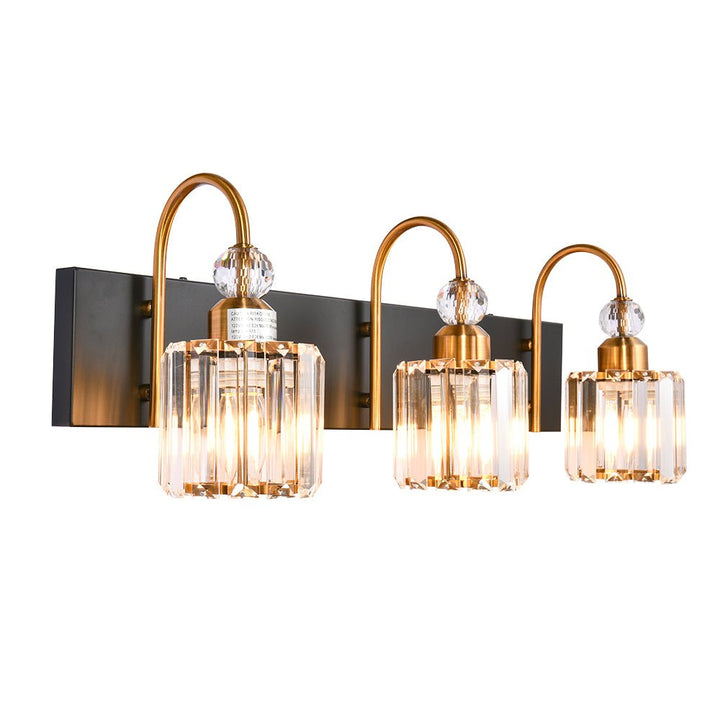 Luz de vanity sofisticada, diseño en cromo con acentos decorativos.
