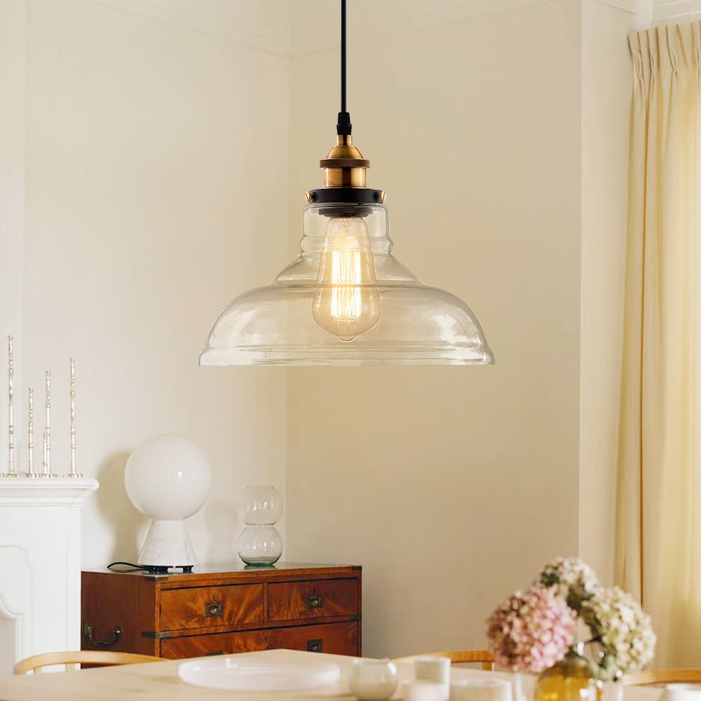 Lámpara colgante minimalista con cúpula de vidrio claro, diseño moderno para el hogar.