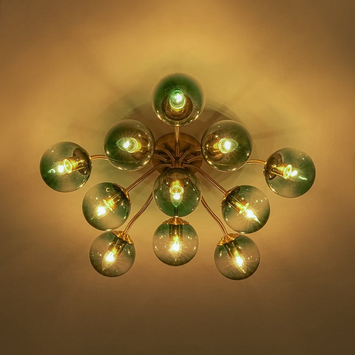 Luz de techo semiempotrada Sputnik con globos de vidrio azul, ideal para interiores.