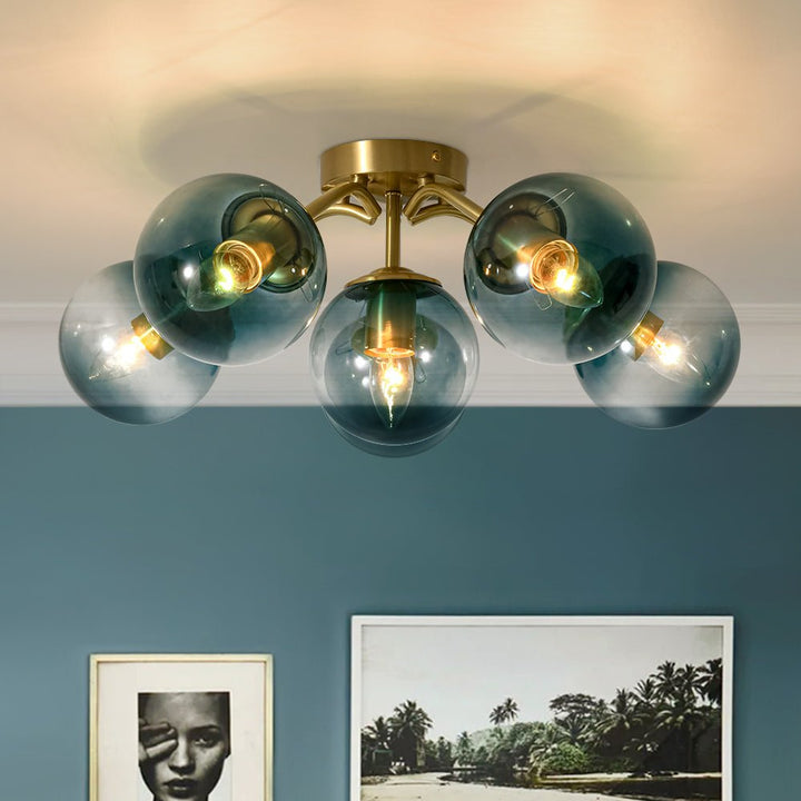 Lámpara de techo semiempotrada estilo Sputnik con esferas de cristal azul para sala.