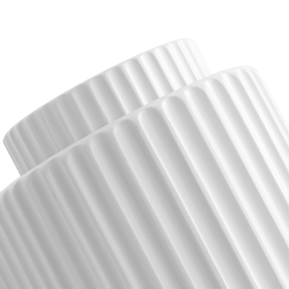 Luz de pared nórdica cilíndrica. Diseño de capas único que crea un ambiente acogedor en cualquier habitación.