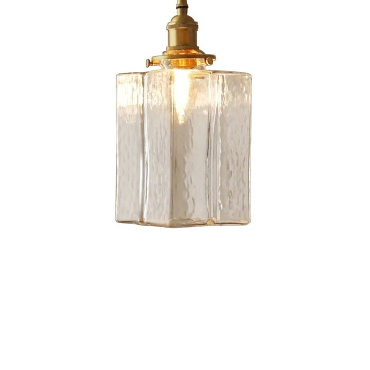 Colgante retro de latón y vidrio agua. Iluminación vintage para comedor o sala.