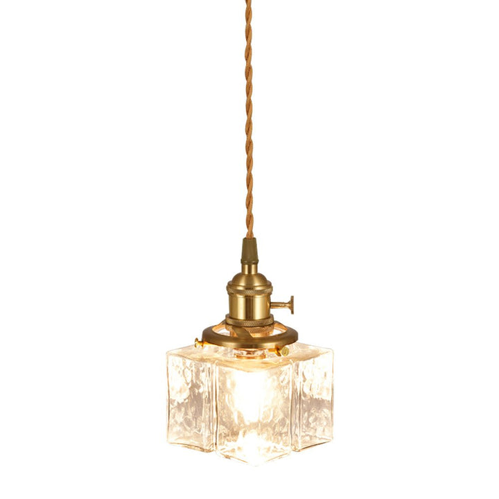 Lámpara colgante vintage de vidrio martillado. Iluminación retro para espacios modernos.